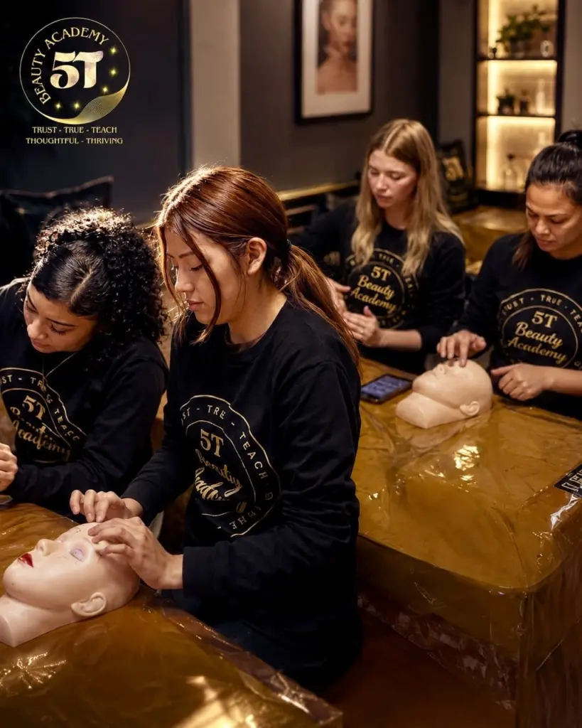 Esthetician students practicing practical exam procedures during State Board preparation training at 5T Beauty Academy.