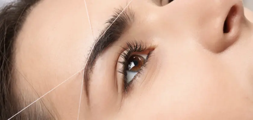 Eyebrow threading service in Raleigh NC at 5T Beauty Academy for precise hair removal and smooth skin